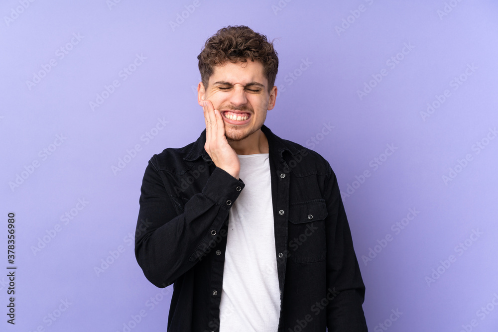 Caucasian man isolated on purple background with toothache Caucasian man isolated on purple background with toothache