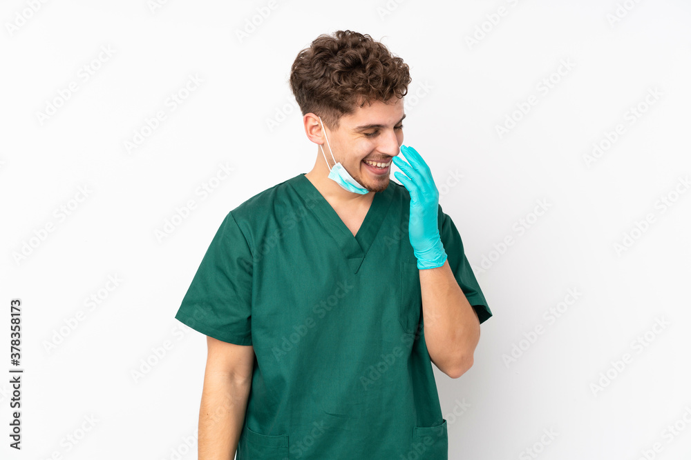 Surgeon in green uniform isolated on isolated white background smiling a lot Surgeon in green uniform isolated on isolated white background smiling a lot