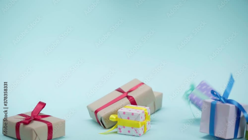 Gift boxes falling on blue background Gift boxes falling on blue background