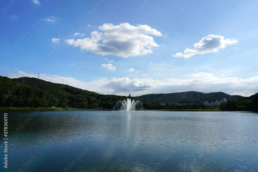Fountain in the lake under the blue sky Fountain in the lake under the blue sky