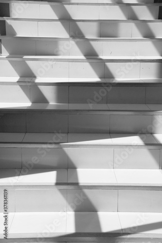Abstract background of shadows leaf on Step of rock stair with vintage style.
