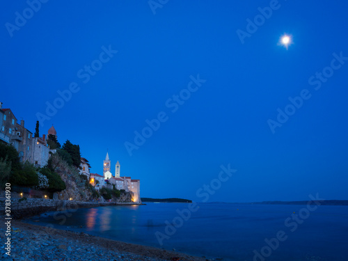 Blue hour and full moon on a beach at island rab in croatia