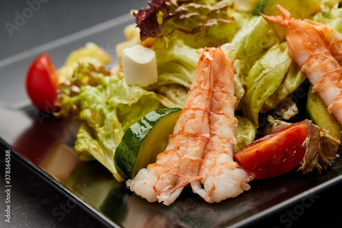 Fresh seafood salad served with prawns (shrimps )