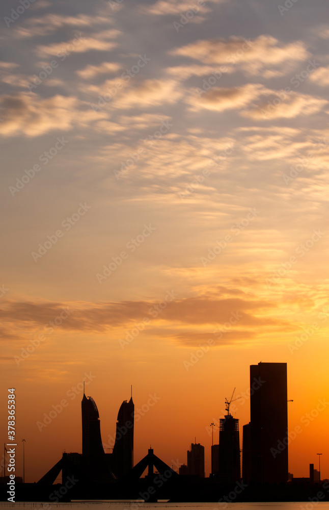 MANAMA , BAHRAIN - DECEMBER 02: Sheikh Salman Causeway bridge and Bahrain iconic  buildings during sunset on December 02, 2019, Bahrain