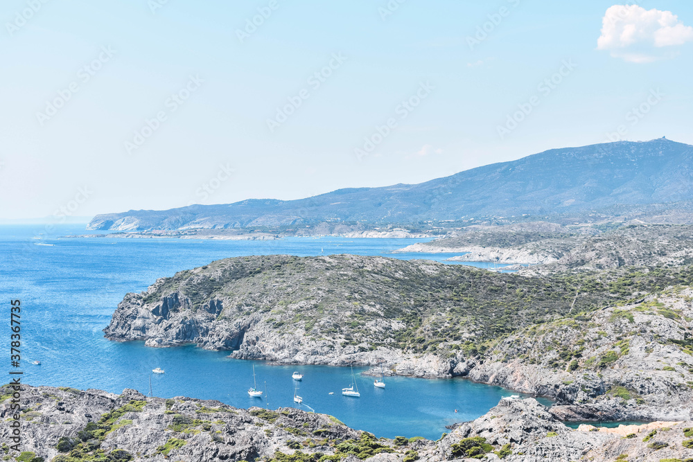 Blue sea and coastline with some boats