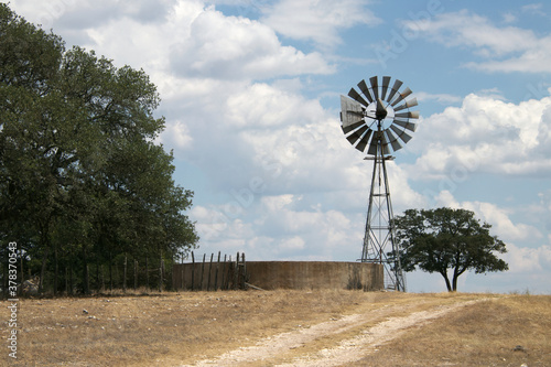 windmill and water tank in Texas hill country