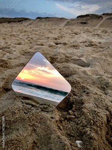 sunset in mirror on the beach