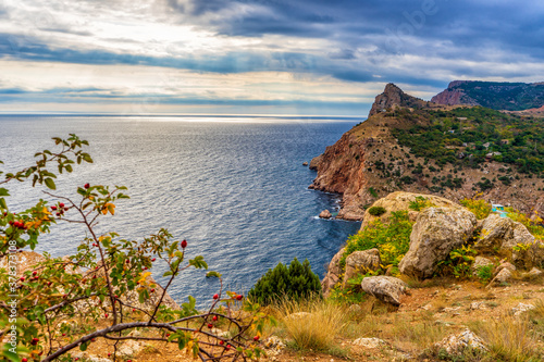 Beautiful panoramic landscape with sea coast in mountain area. Picturesque seascape with sky, water and coastline in autumn cloudy day. Black sea, Sevastopol vicinity, Crimea, Russia