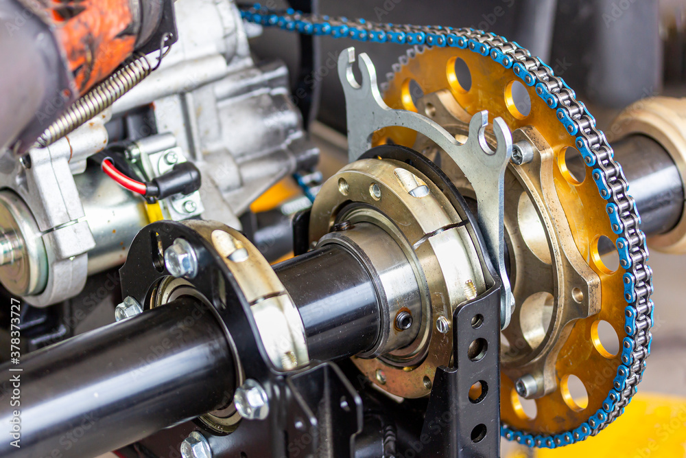 Close up mechanical bearings sprocket and chain unit power drive