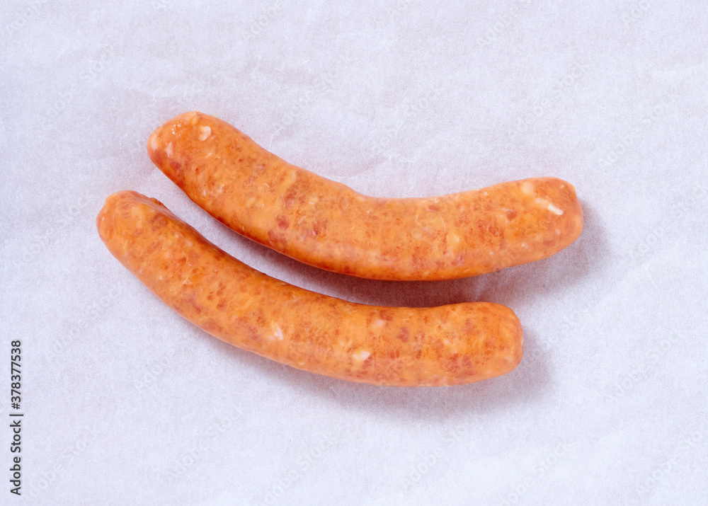 Sausages in a studio setting, isolated on white Sausages in a studio setting, isolated on white
