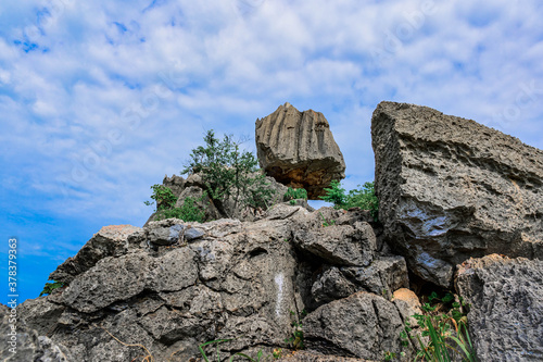 Unseen Thailand of In Kwaen at Khao Chong Sadet Kanchanaburi, A large stone on the top of the mountain photo