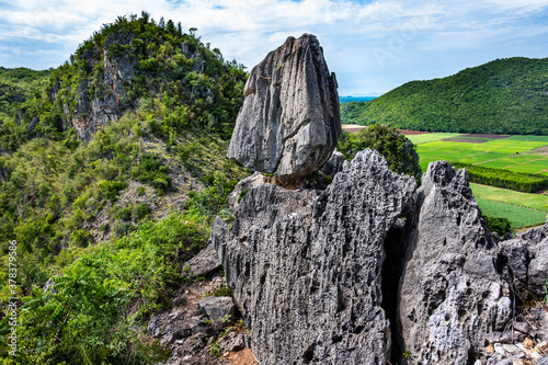 Unseen Thailand of In Kwaen at Khao Chong Sadet Kanchanaburi, A large stone on the top of the mountain photo