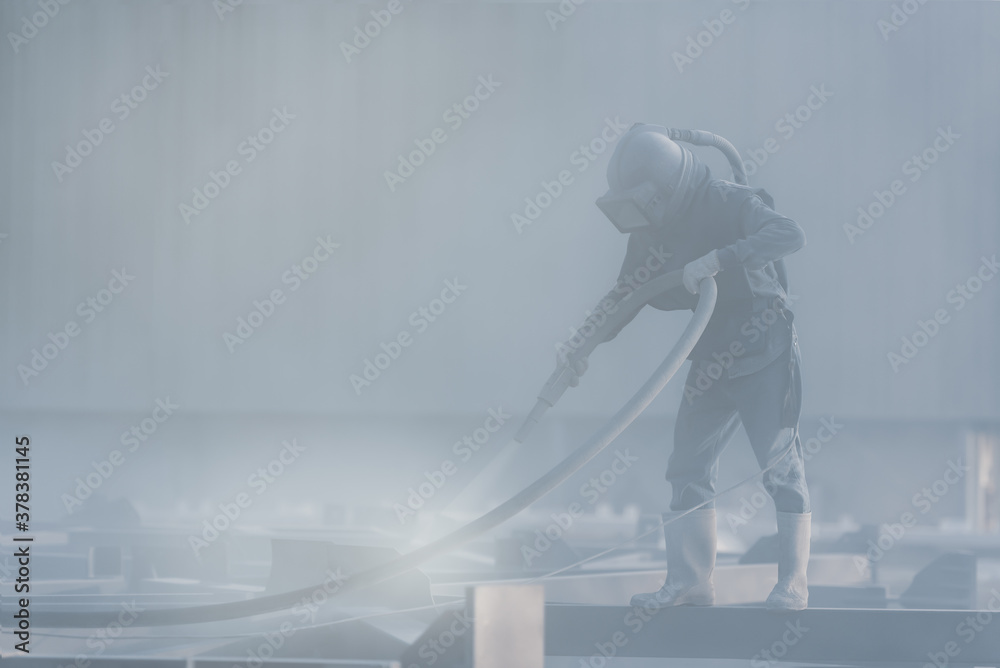 Sand blasting process, Industial worker using sand blasting process