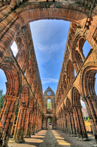 Jedburgh Abbey, a ruined Augustinian abbey which  situated in the town of Jedburgh, Scotland photo