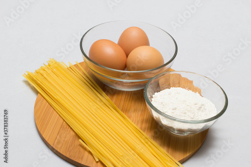 Raw homemade Egg noodles and ingredients for Egg noodles