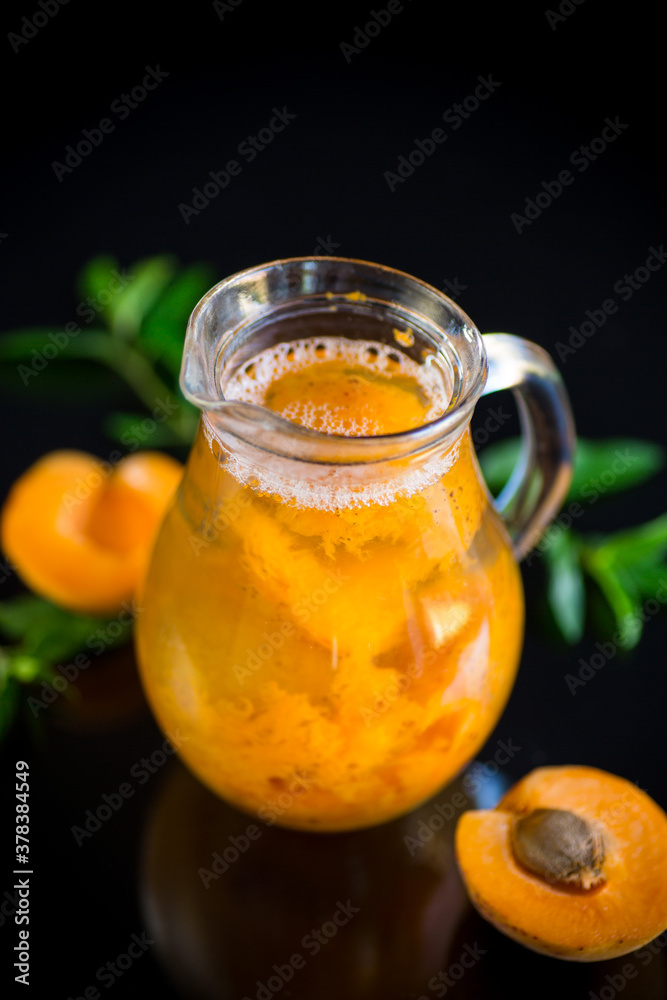 cold apricot compote in a glass decanter cold apricot compote in a glass decanter