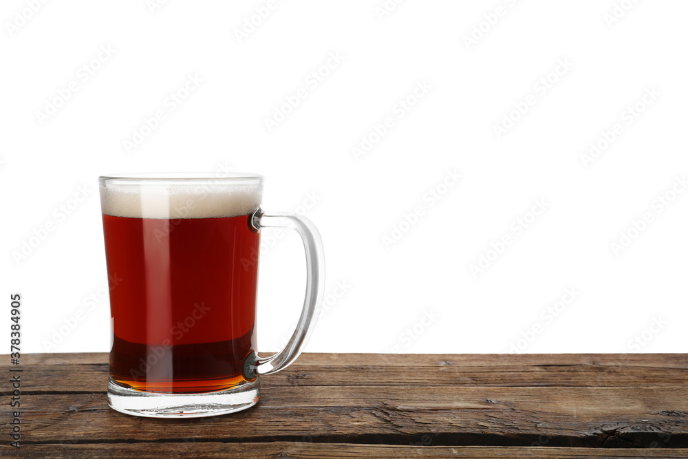 Glass mug of delicious kvass on wooden table, white background Glass mug of delicious kvass on wooden table, white background