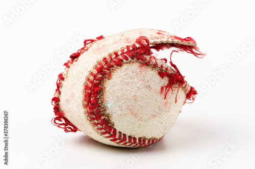 Photography Baseball ball that is ripped and useless on white background