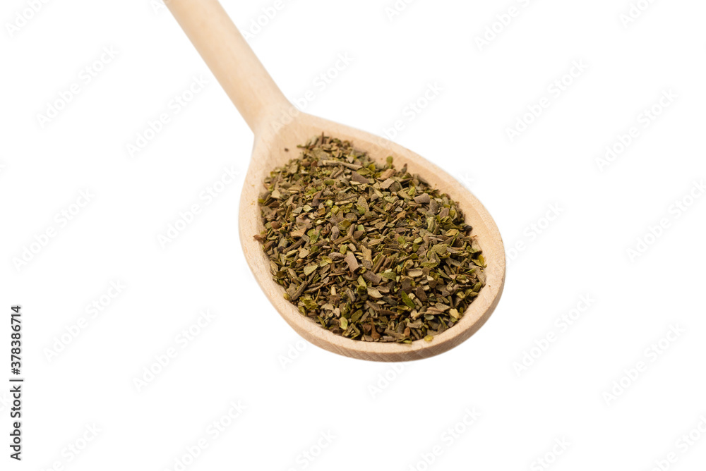 Oregano spice in wooden spoon isolated. Oregano spice in wooden spoon isolated.