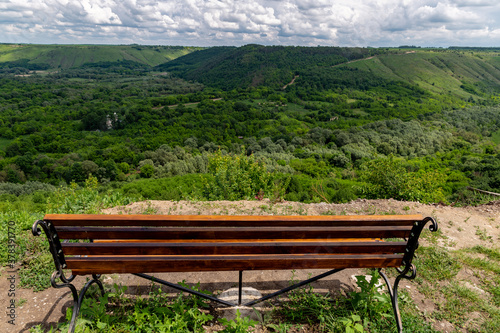 beautiful view with a bench on the canyon on a summer day