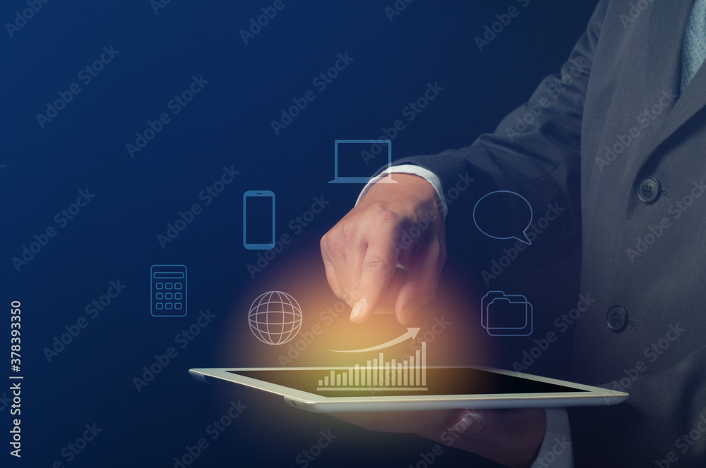 businessman use tablet computer with bar graph and digital symbol. business efficiency and effectiveness presentation concept businessman use tablet computer with bar graph and digital symbol. business efficiency and effectiveness presentation concept