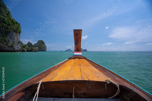 Traditional wooden boat ride in Phi Phi Islands sea Koh Phi Phi, Thailand.