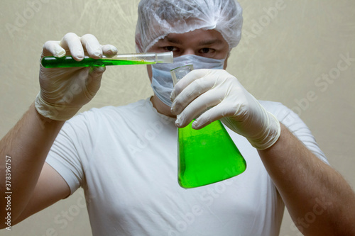 scientist in laboratory mixing chemicals