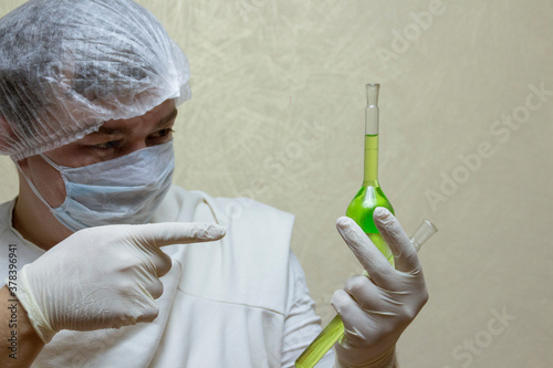 scientist in laboratory with tubes syringe