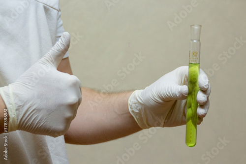 hand holding a syringe