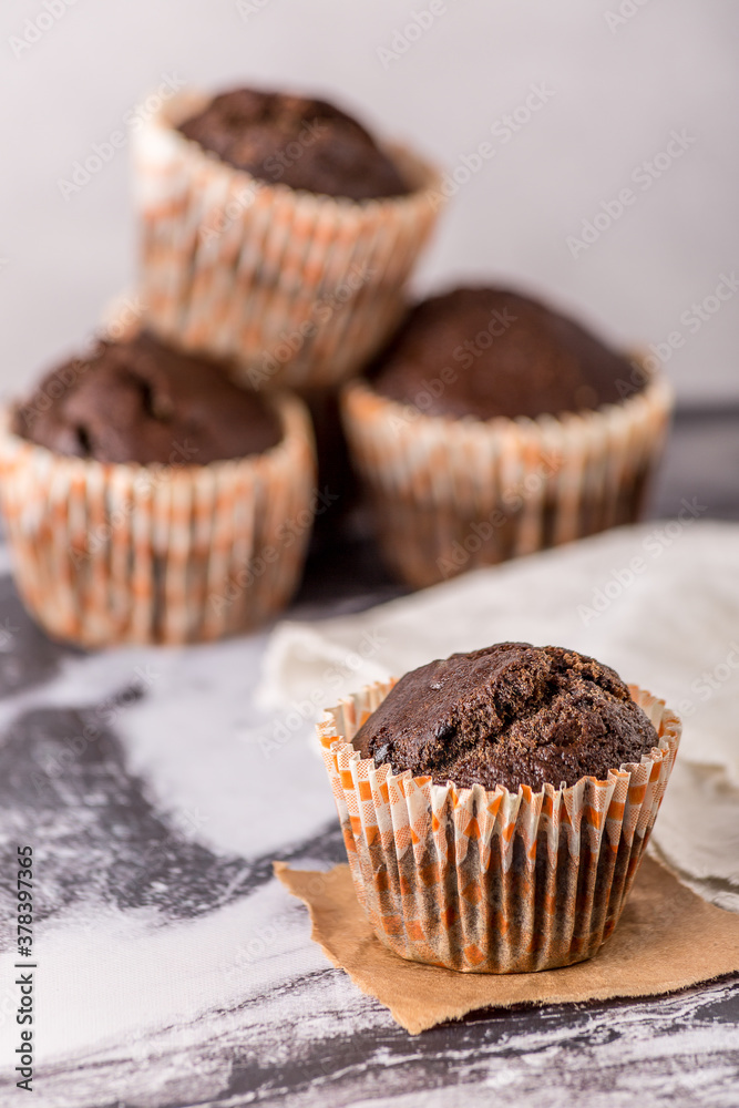 Sweet cakes or cupcakes on light marble background. Holiday cake celebration, delicious dessert, close up