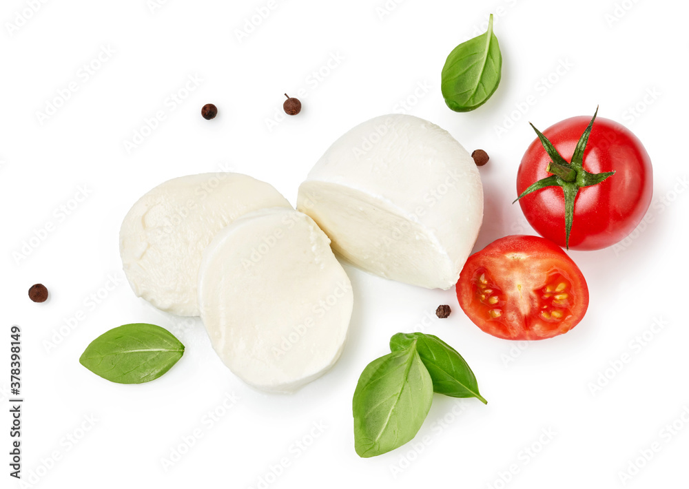 Pieces of mozzarella Buffalo cheese with basil leaves. Top view of sliced cheese with tomatoes isolated on white background. Pieces of mozzarella Buffalo cheese with basil leaves. Top view of sliced cheese with tomatoes isolated on white background.