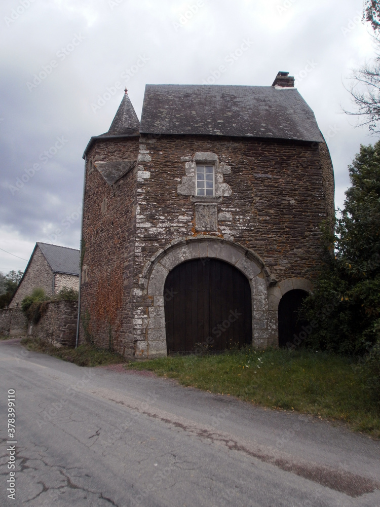 Fototapeta premium Paimpont, France - August 8, 2011 : Focus on a very old house in stone, in medieval style.