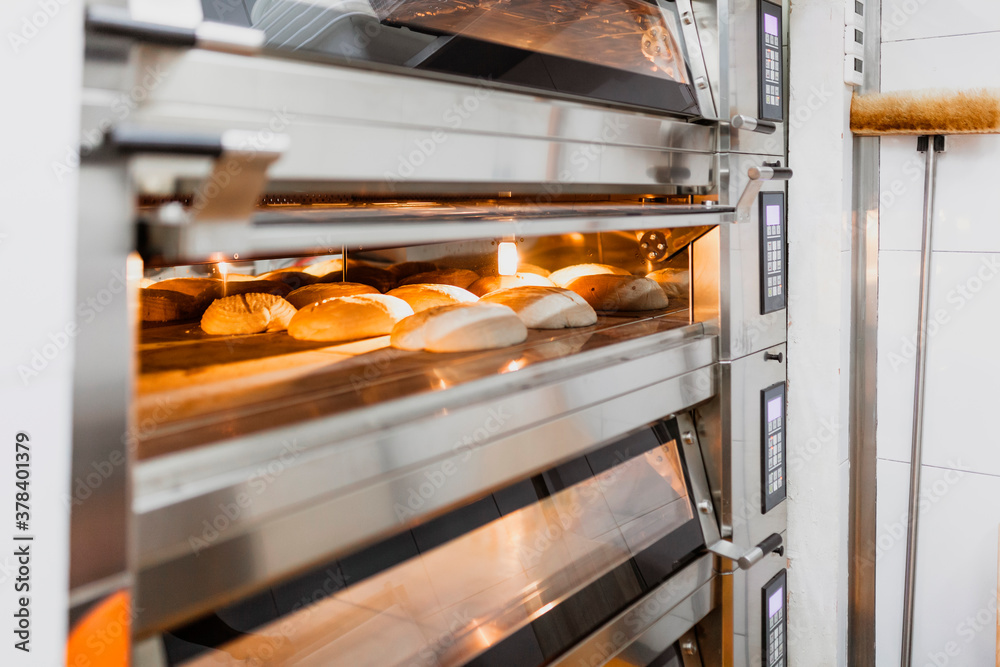 Bread baking bread in oven at commercial kitchen Bread baking bread in oven at commercial kitchen