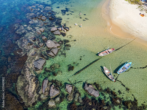 Vietnam, Phu Quo island, Ong Lang beach, Boats moored on coast, aerial view photo