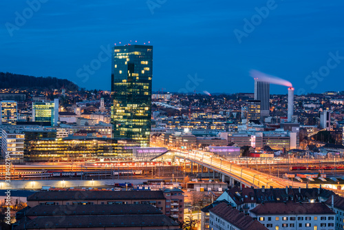Switzerland, Zurich, Cityscape with Prime Tower and Hard Bridge illuminated at night