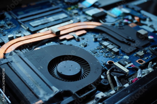 parts of a disassembled laptop from dust and dirty close up in workshop or repairing. Krakow, Poland 21.01.2020