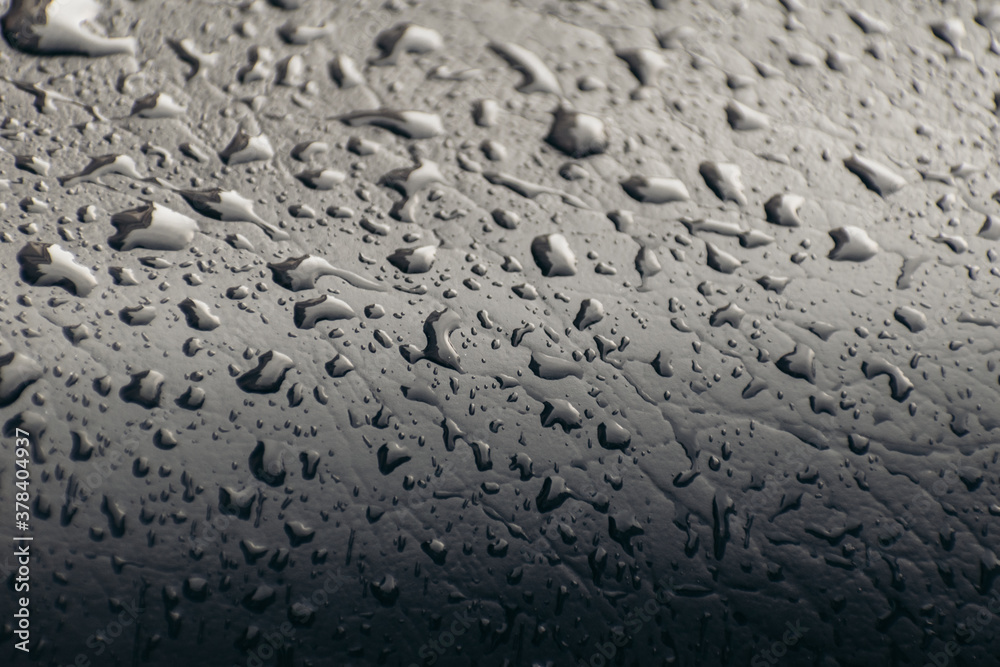 Close up shot of rain drops on black color background
