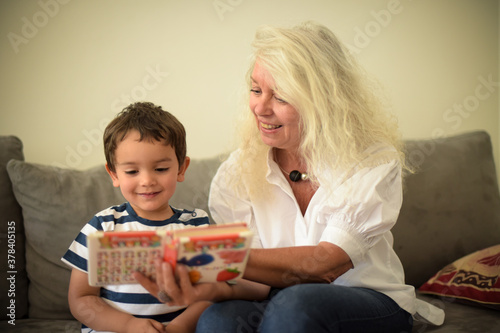 young boy and his grandmother at home
