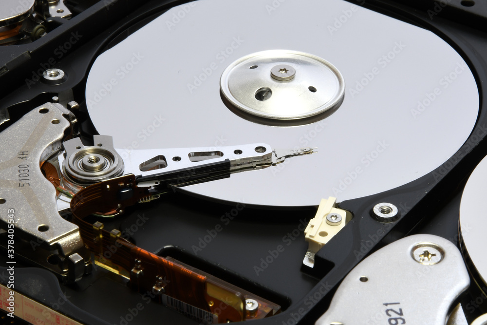 closeup of aligned open computer hard disk drives closeup of aligned open computer hard disk drives