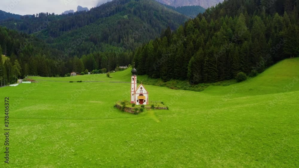 Aerial view of the beautiful village of Santa Magdalena in Tyrol's. Houses and church are int he middle of Alps mountains in italy - drone view 4K Aerial view of the beautiful village of Santa Magdalena in Tyrol's. Houses and church are int he middle of Alps mountains in italy - drone view 4K