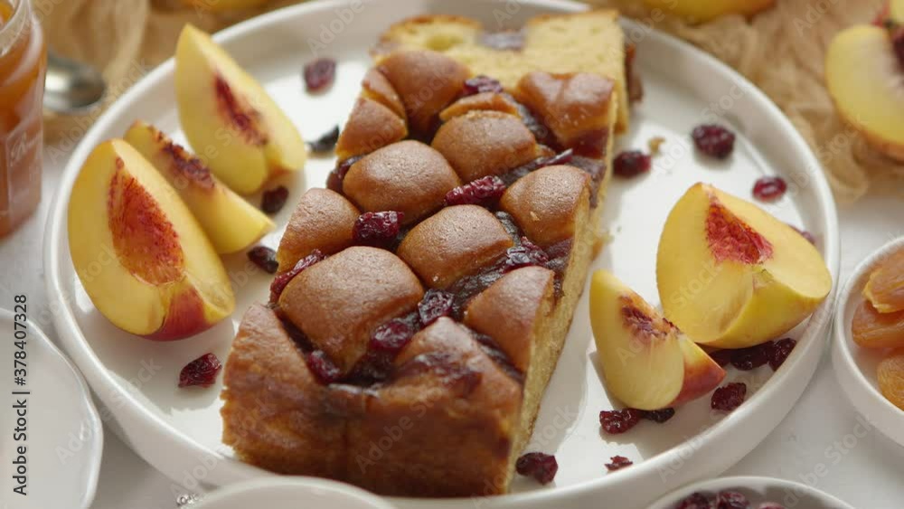 Delicious homemade peach or nectarine cake, fresh fruits, marmalade, cranberry on stone background Delicious homemade peach or nectarine cake, fresh fruits, marmalade, cranberry on stone background