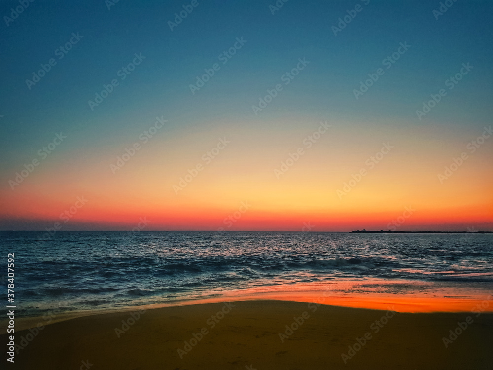 blue hour and red horizon after sunset at kollam beach, kerala , India.