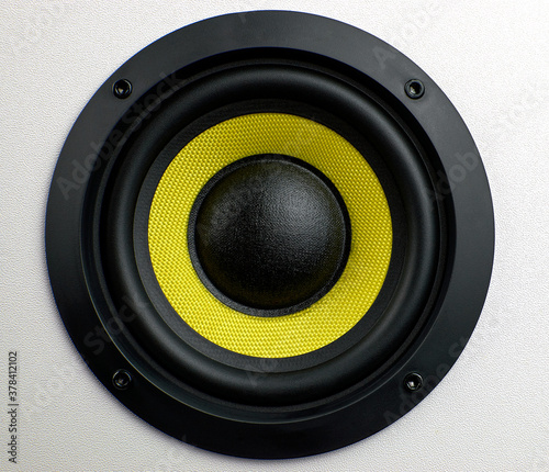 Subwoofer audio speakers. Subwoofer dynamic membrane or sound speaker. Yellow subwoofer  close up