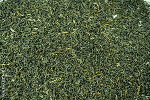 Dry green tea on a background