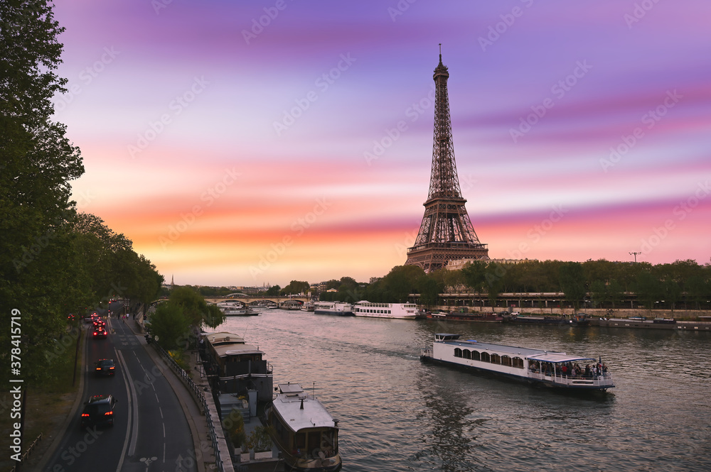 Sunset over the the Eiffel Tower and the Seine River in Paris, France.