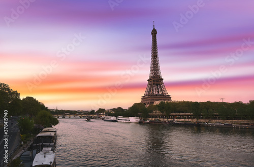 Sunset over the the Eiffel Tower and the Seine River in Paris, France. © Jbyard