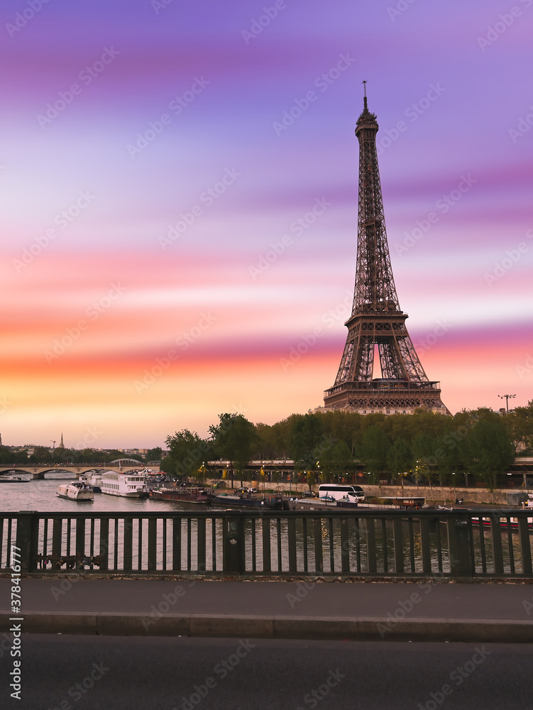 Sunset over the the Eiffel Tower and the Seine River in Paris, France.