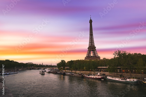 Sunset over the the Eiffel Tower and the Seine River in Paris, France.
