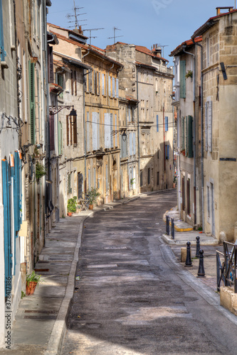 Street with historical houses in Arles  France