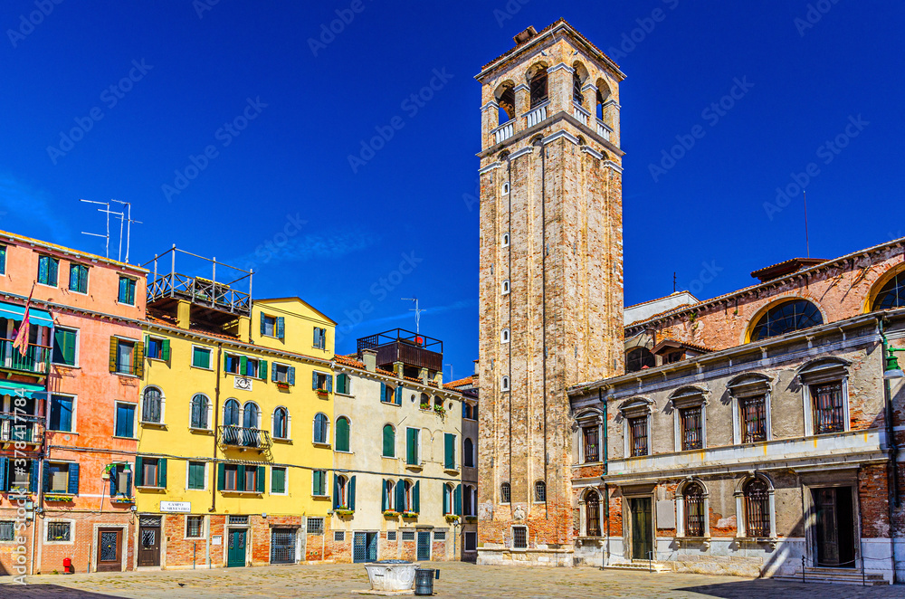 Chiesa San Silvestro catholic church building with bell tower campanile on Campo San Silvestro square in Venice historical city centre, blue sky background summer day, Veneto Region, Northern Italy